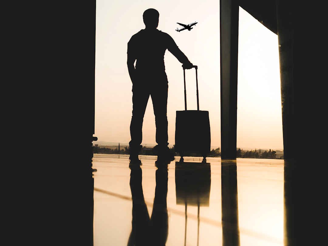 Traveler at airport by Yousef Alfuhigi on Unsplash