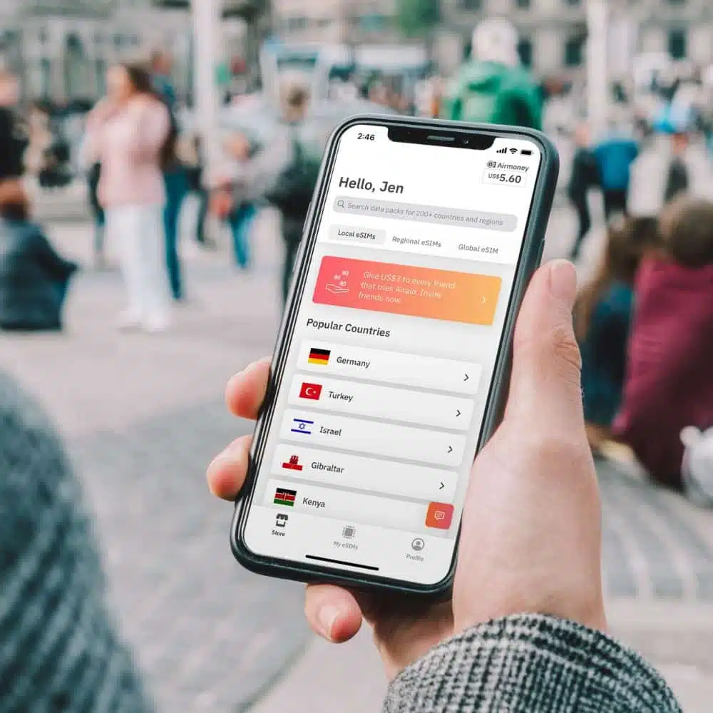 Smartphone displaying the Airalo eSIM app with country data packages available for travellers