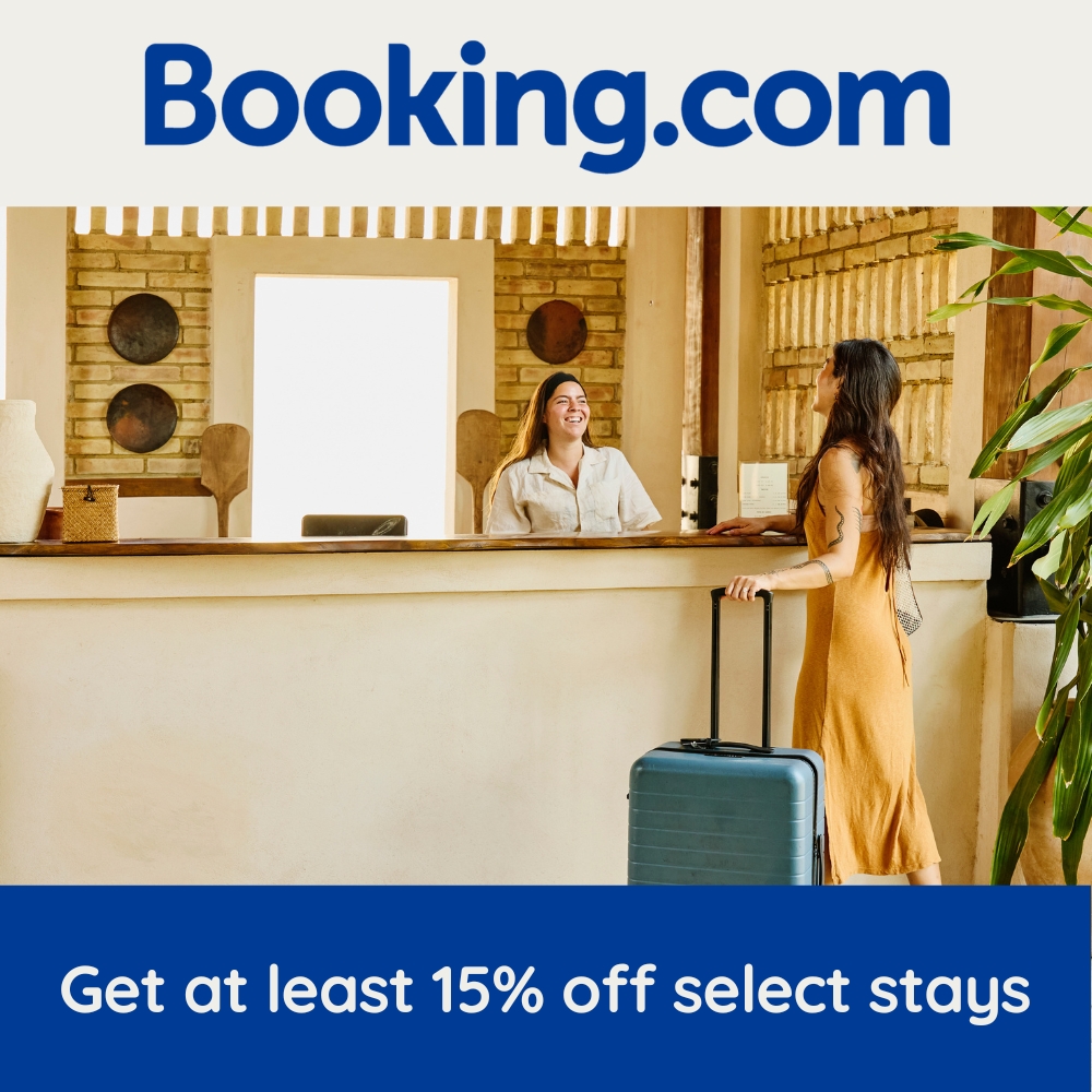 Hotel guest checking in at reception desk