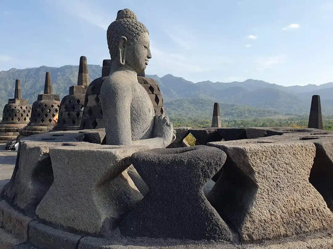 Buddha statue inside stupa at Borobudur buddha statue inside stupa at borobudur