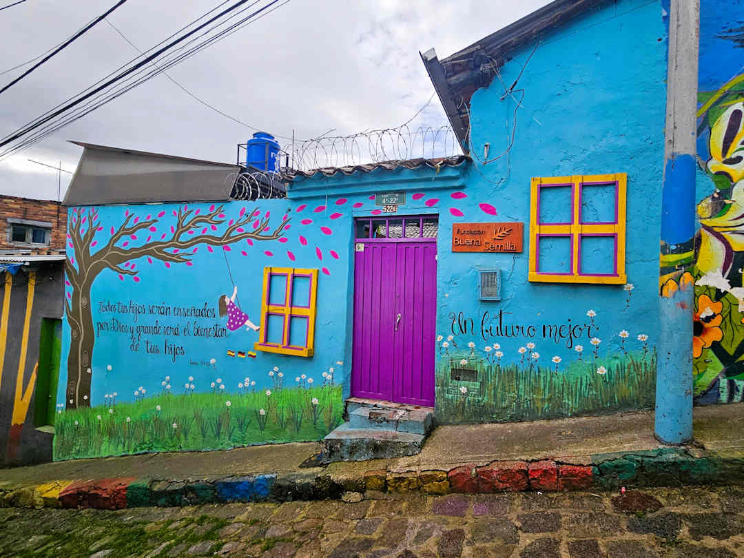 buena semilla foundation at barrio egipto Colourful mural at Fundación Buena Semilla in Barrio Egipto Bogotá, a community partner of the Breaking Borders Walking Tour