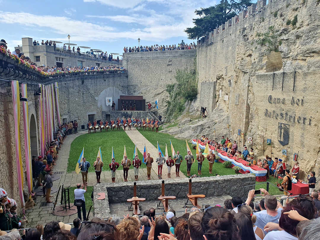 crossbow tournament san marino Historic festival with performers in medieval courtyard.