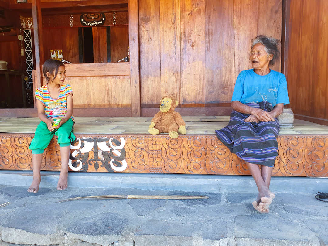 girl and mother in indonesian village