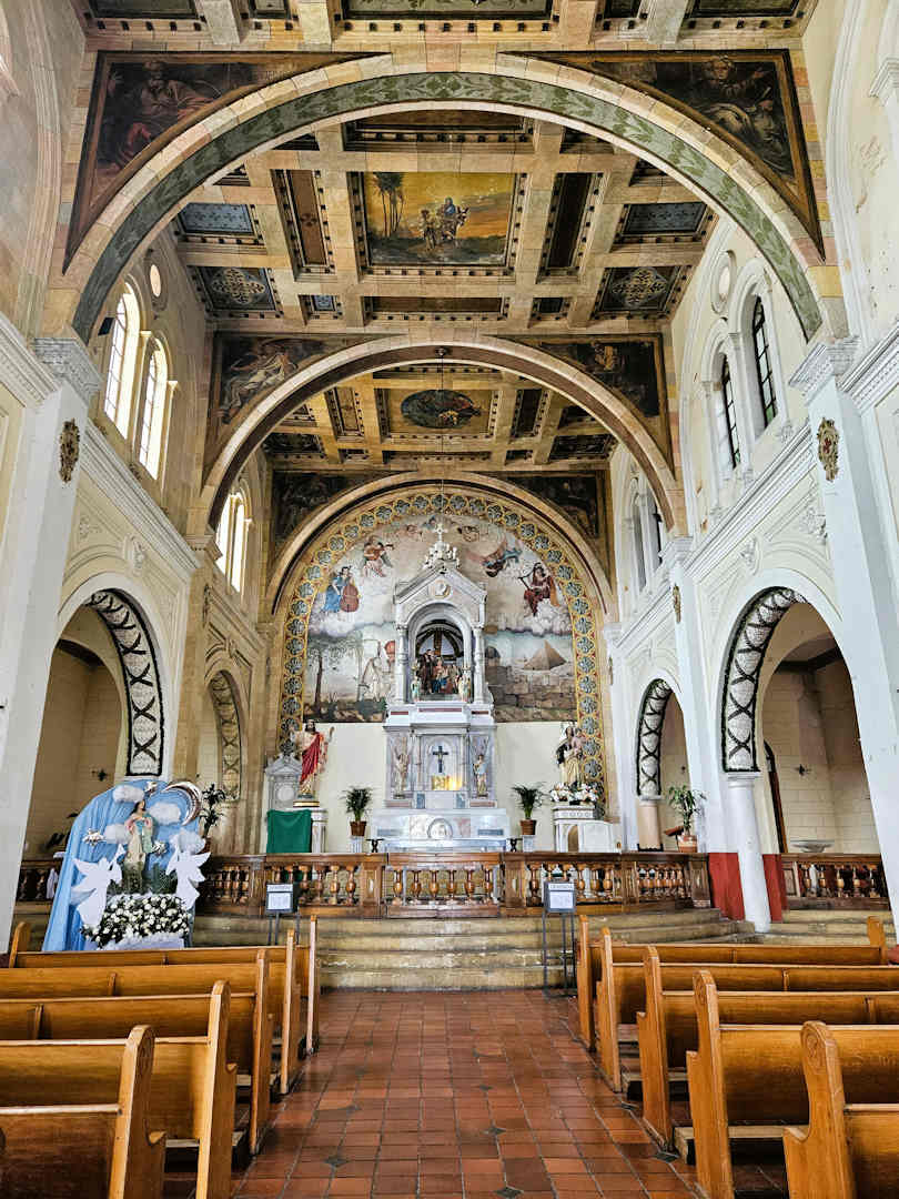 interior of our lady of egypt church bogota Altar and Italian frescoes inside the Church of Nuestra Señora de Egipto in Bogotá, a highlight of the Barrio Egipto Walking Tour