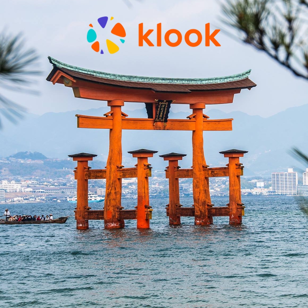 Klook logo displayed above the Itsukushima Shrine torii gate in Miyajima, Japan