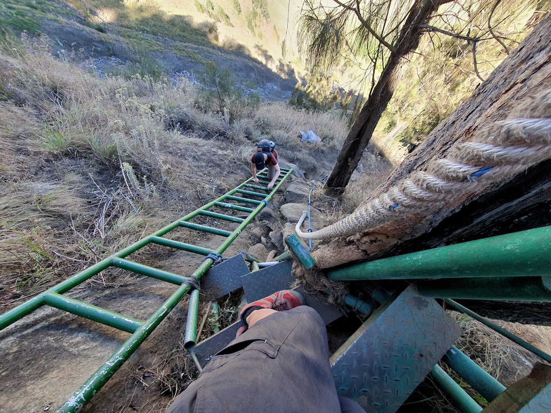 ladders and steps on mt rinjani crater rim wall