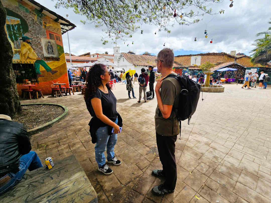paul and impulse travel guide at chorro de quevedo Travellers at Chorro de Quevedo square in Bogotá, the meeting point for the Barrio Egipto Breaking Borders Walking Tour