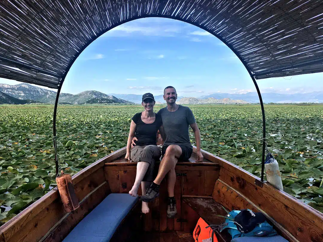 paul and sandra among skadar lake waterlilies Paul and Sandra on Lake Skadar Boat Tour Surrounded by Waterlilies in Montenegro