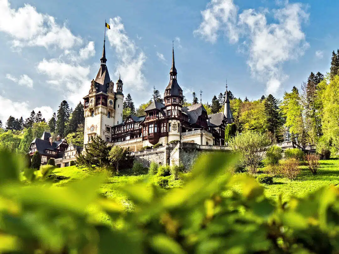 Peleș Castle Romania with Neo-Renaissance Towers and Forest Backdrop