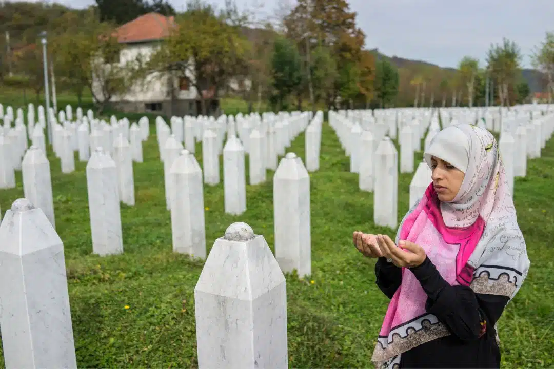 Praying at Srebrenica Genocide Memorial