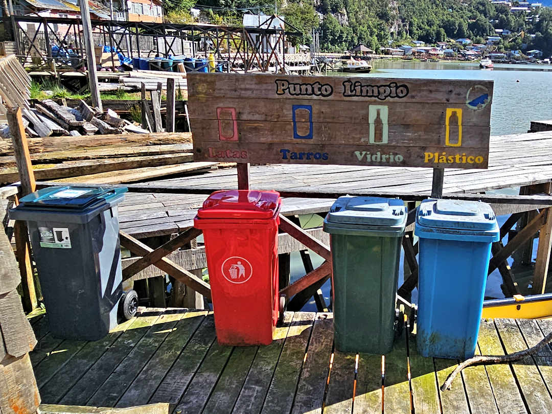 public waste station with differently colour bins in tortel, Chile