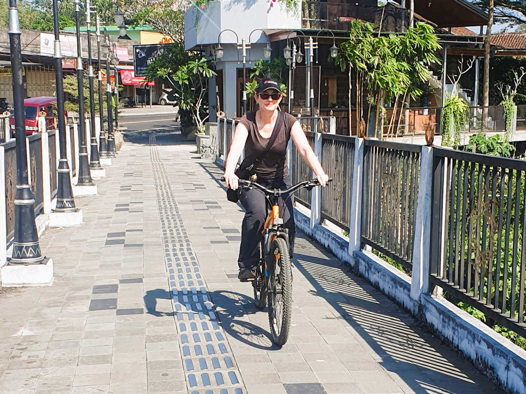 Sandra on bicycle in Borobudur