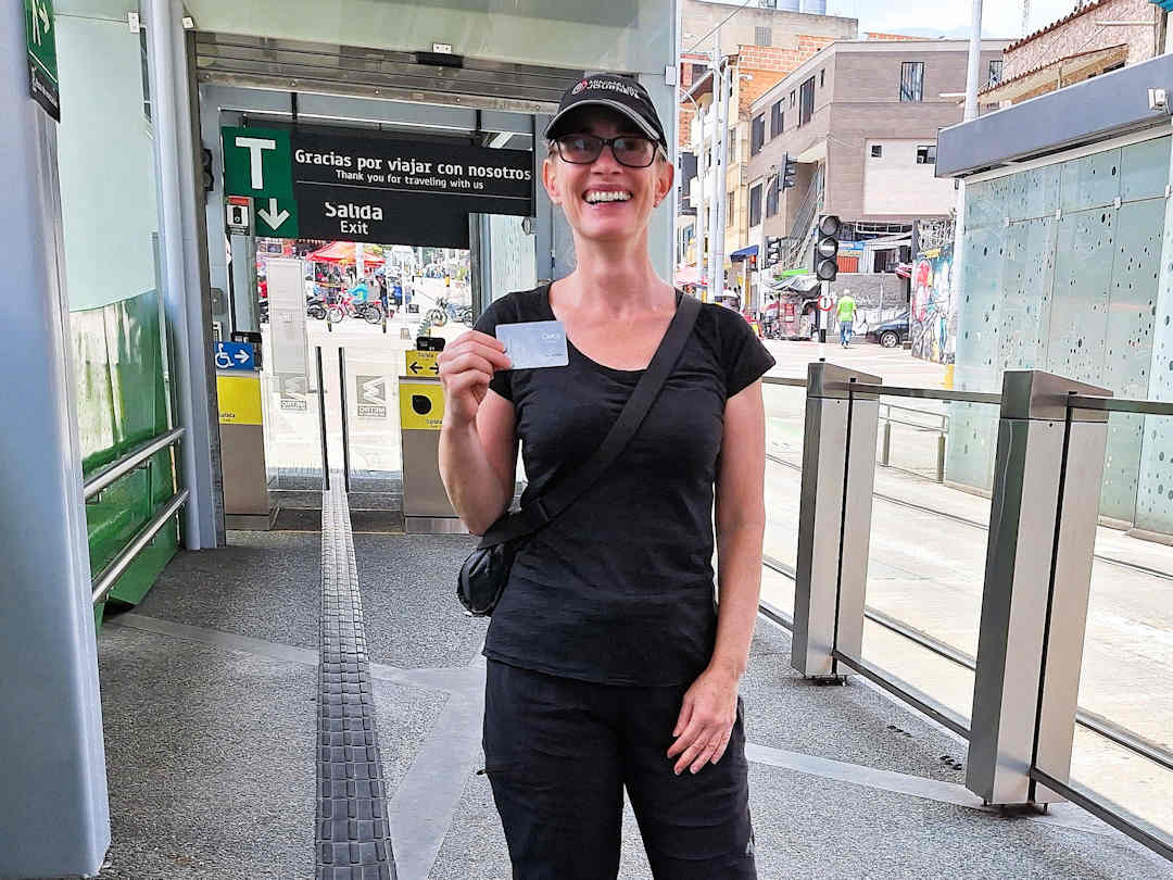 sandra with eventual civica card Traveller holding metro ticket at Caribe Metro Station in Medellín, the meeting point for the Comuna 4 walking tour