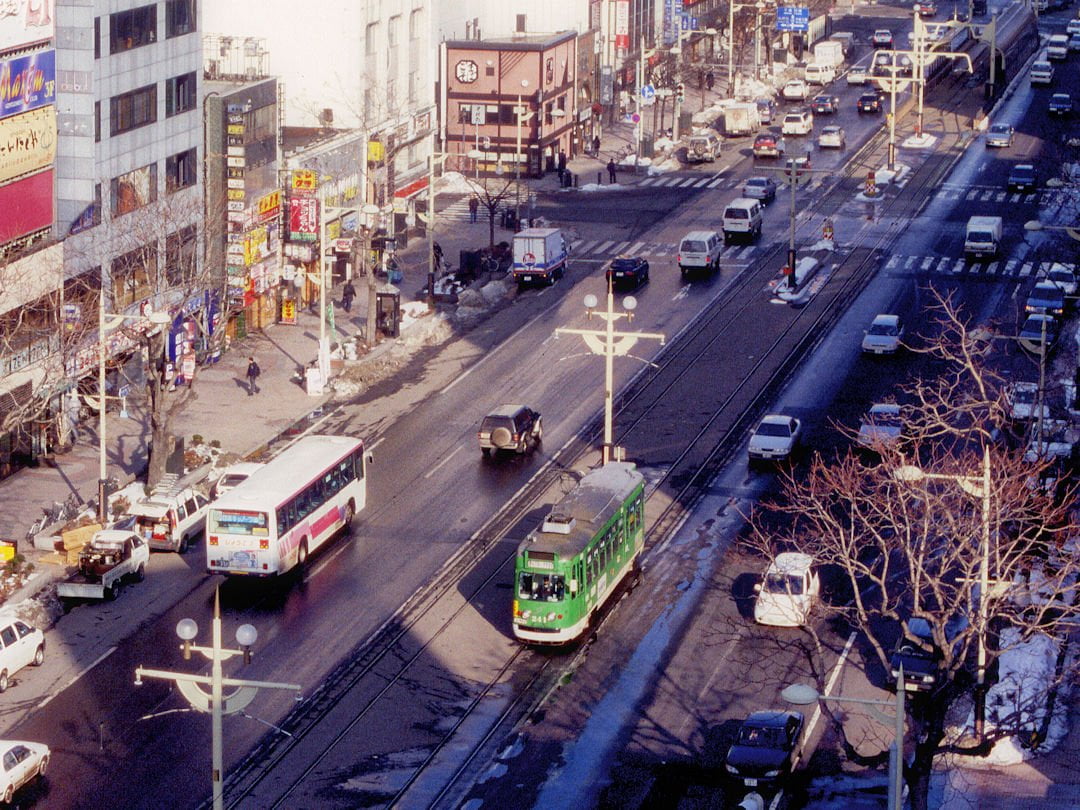 sapporo street with streetcar and bus by city of sapporo