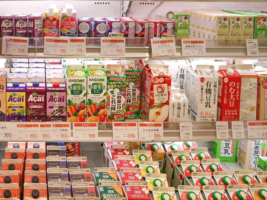 supermarket shelf with pricing by joan tran on unsplash