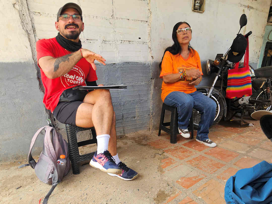 toto and heroína at barrio llanitos in moravia Real City tour guide and local leader speaking to visitors about Moravia’s transformation in Comuna 4, Medellín