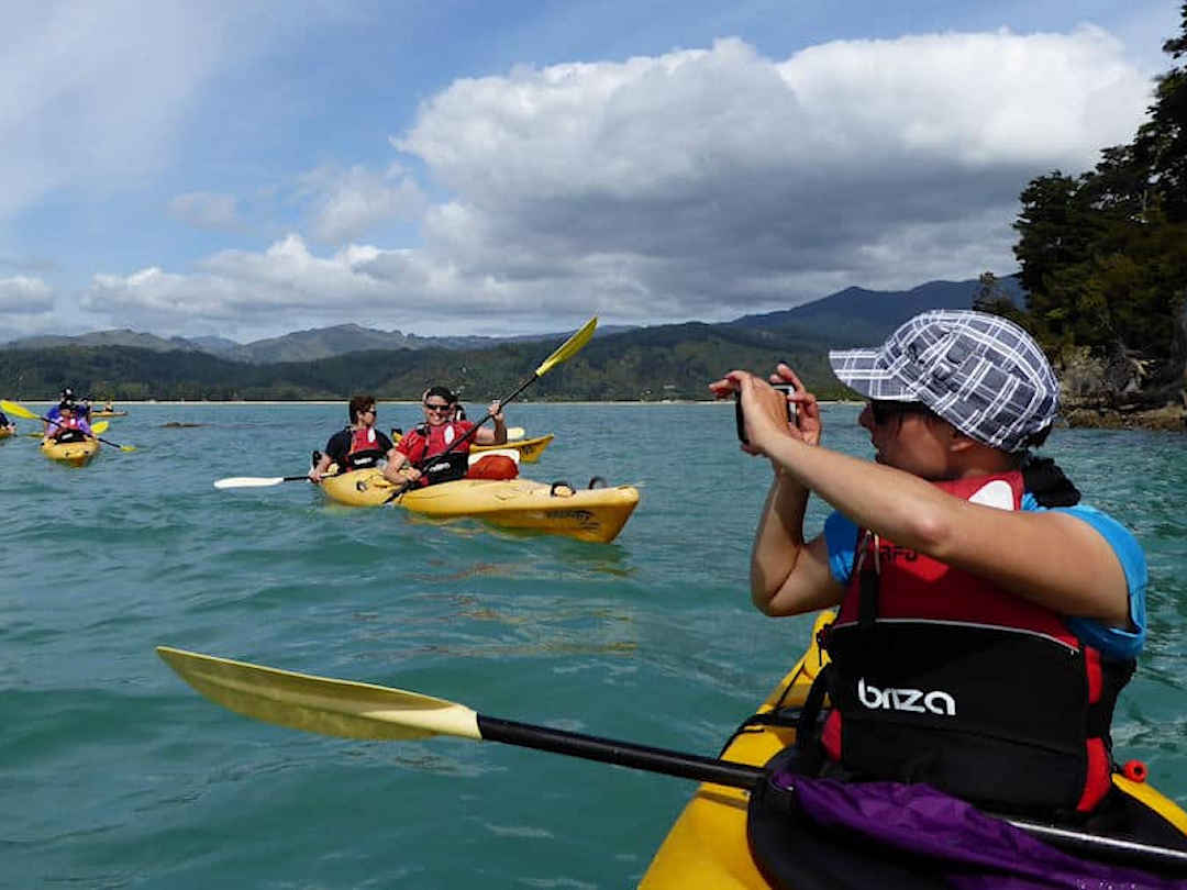 tourist group kayaking in abel tasman