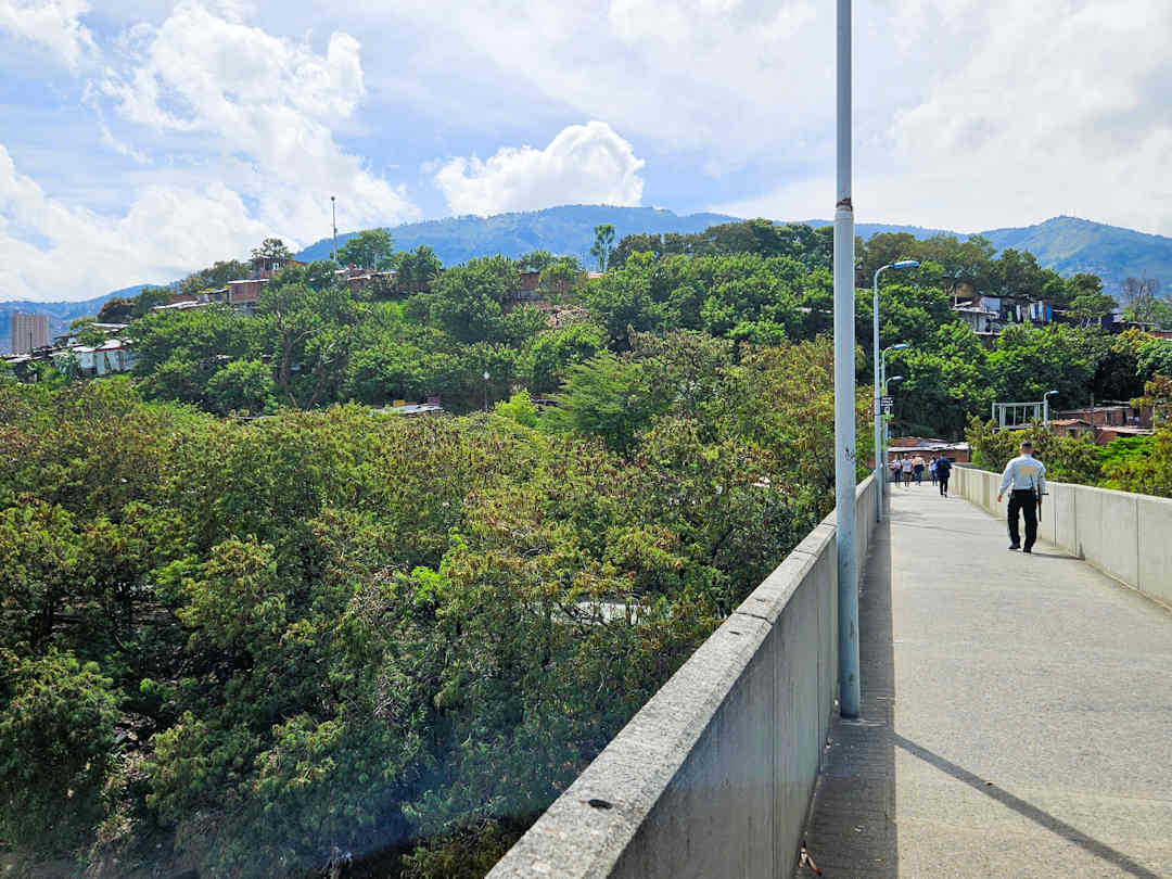 view of el morro from caribe metro station El Morro hill in Moravia, Medellín, seen from the pedestrian bridge during the Comuna 4 walking tour