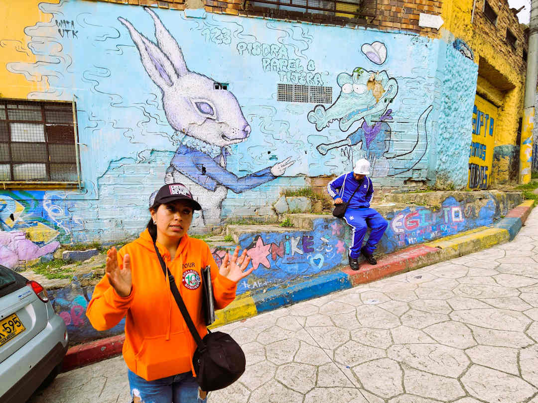 Rabbit and Crocodile Mural – Barrio Egipto Breaking Borders Tour Bogotá Breaking Borders guide explains the Rabbit and Crocodile mural in Barrio Egipto Bogotá during the community walking tour